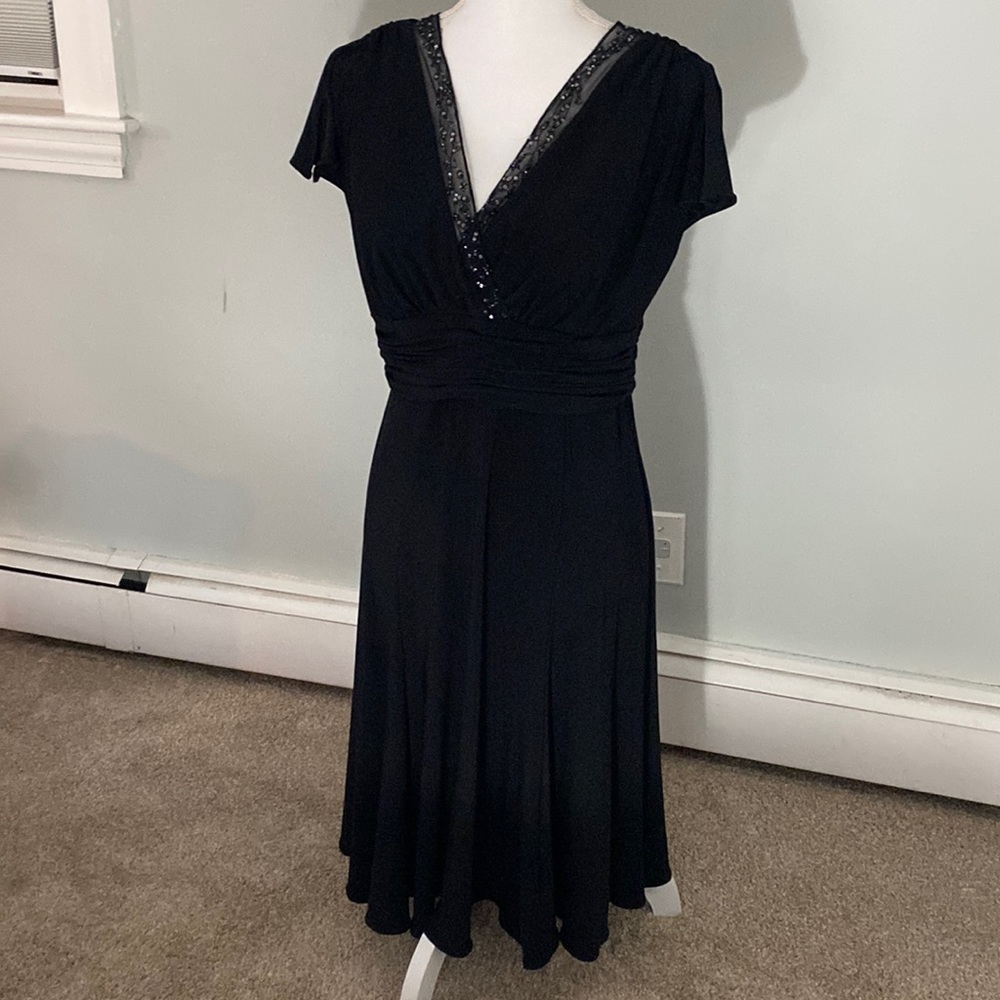 Black cocktail dress with beaded v neckline